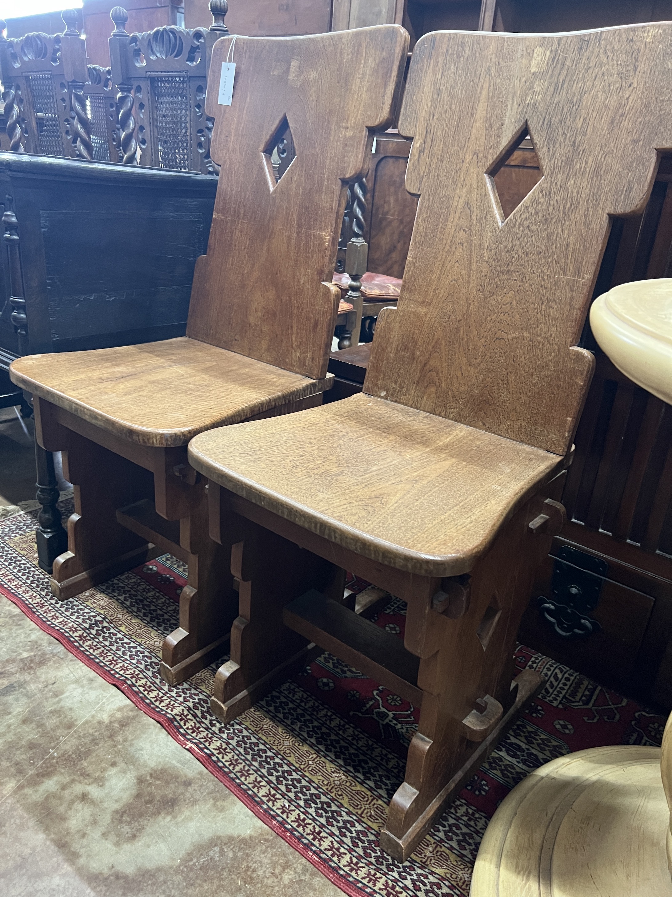 A pair of oak hall chairs, width 44cm, depth 41cm, height 105cm